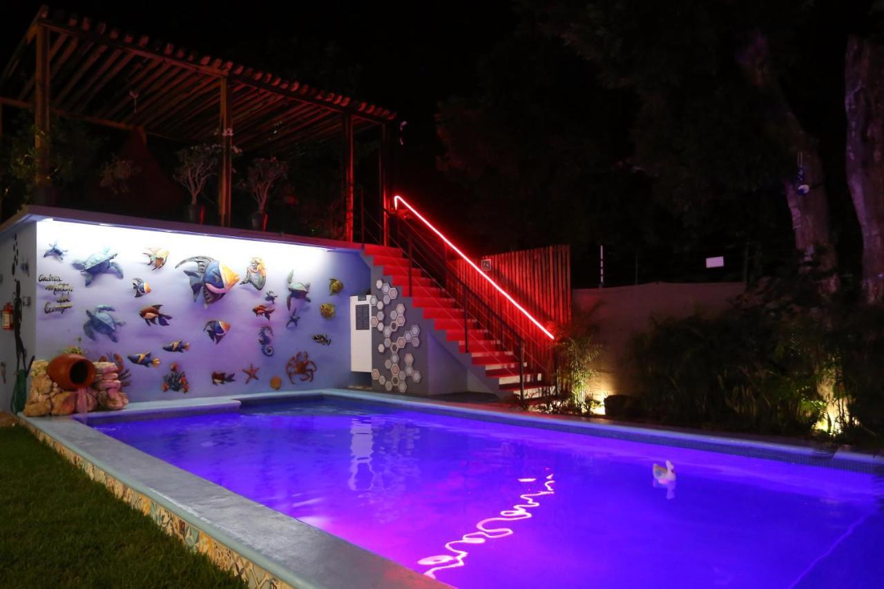 Casa Chukum Hotel Bacalar Bagian luar foto The swimming pool at the hotel