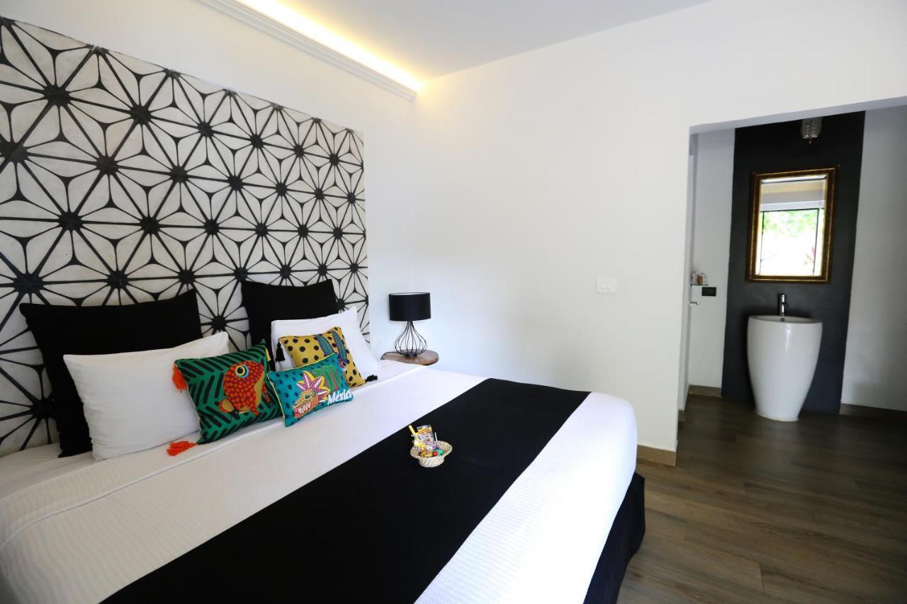Casa Chukum Hotel Bacalar Bagian luar foto A bedroom at the hotel